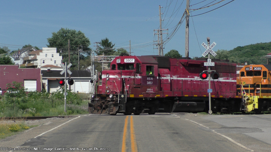 The local pulls into the yard